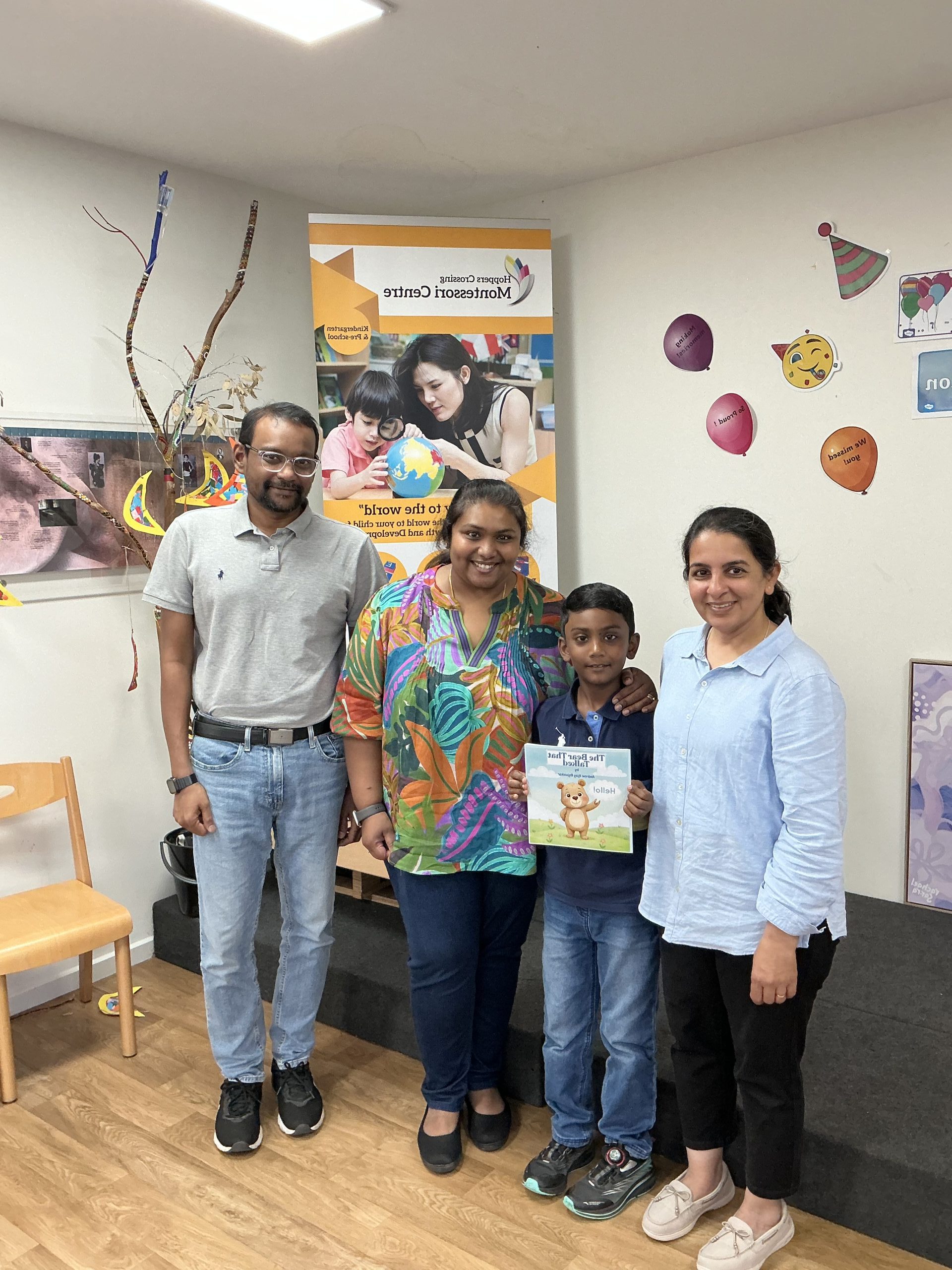 Author visit Montessori Ajay reading to children